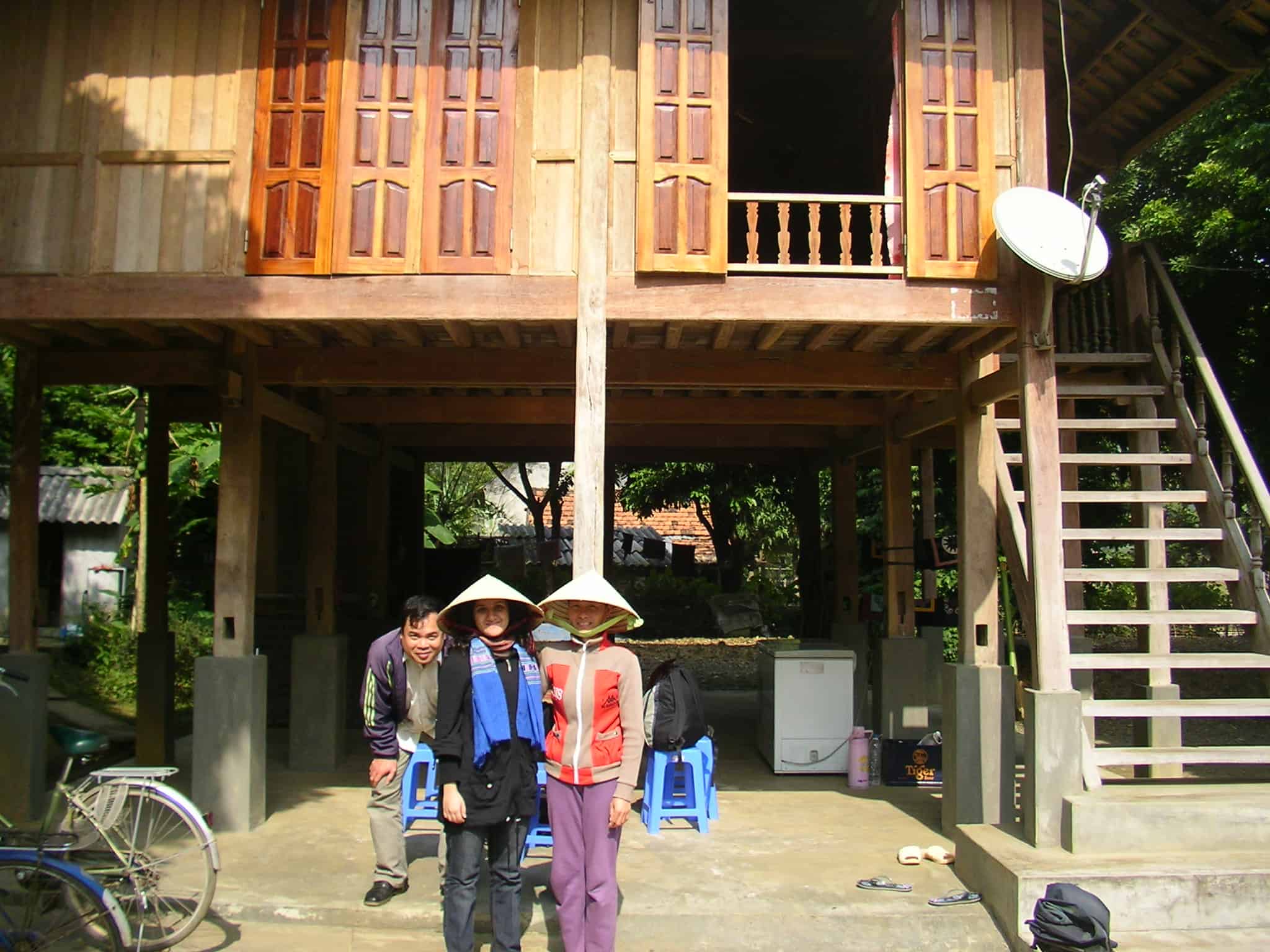 With the house owners, Hao & Binh, in traditional Vietnamese hats Ben Lac, Mai Chau, North Vietnam, Vietnam, stilt house, homestay