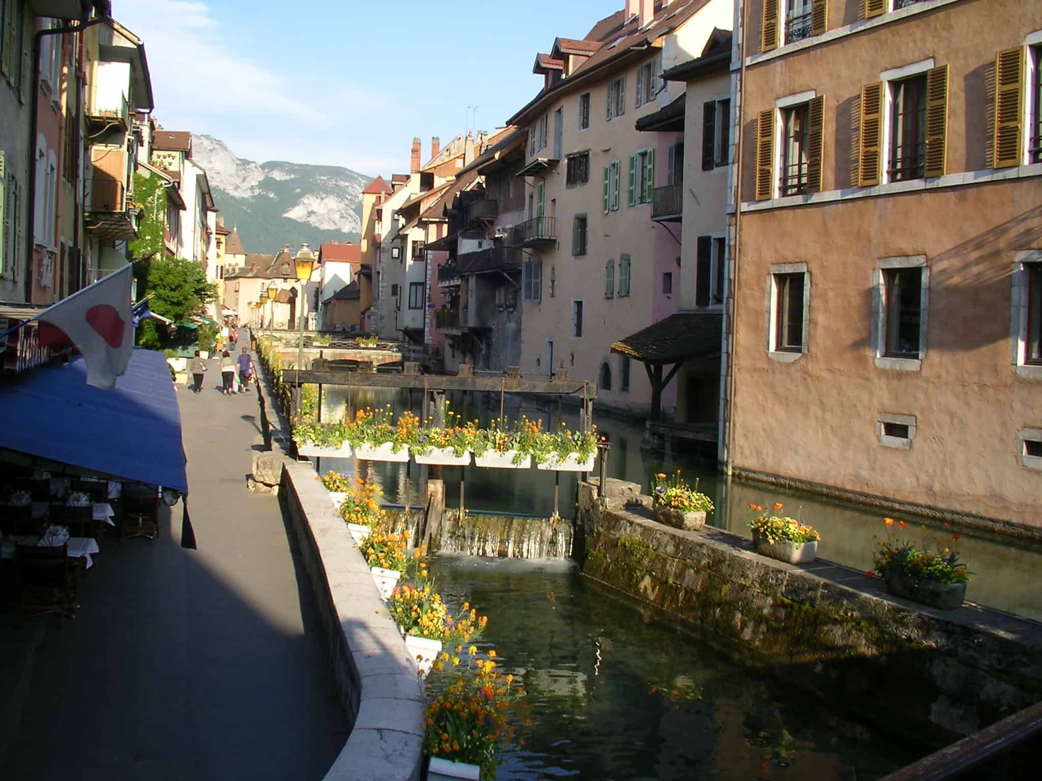 The canal with the Alps in the background. canal, Annecy, old town, Alps