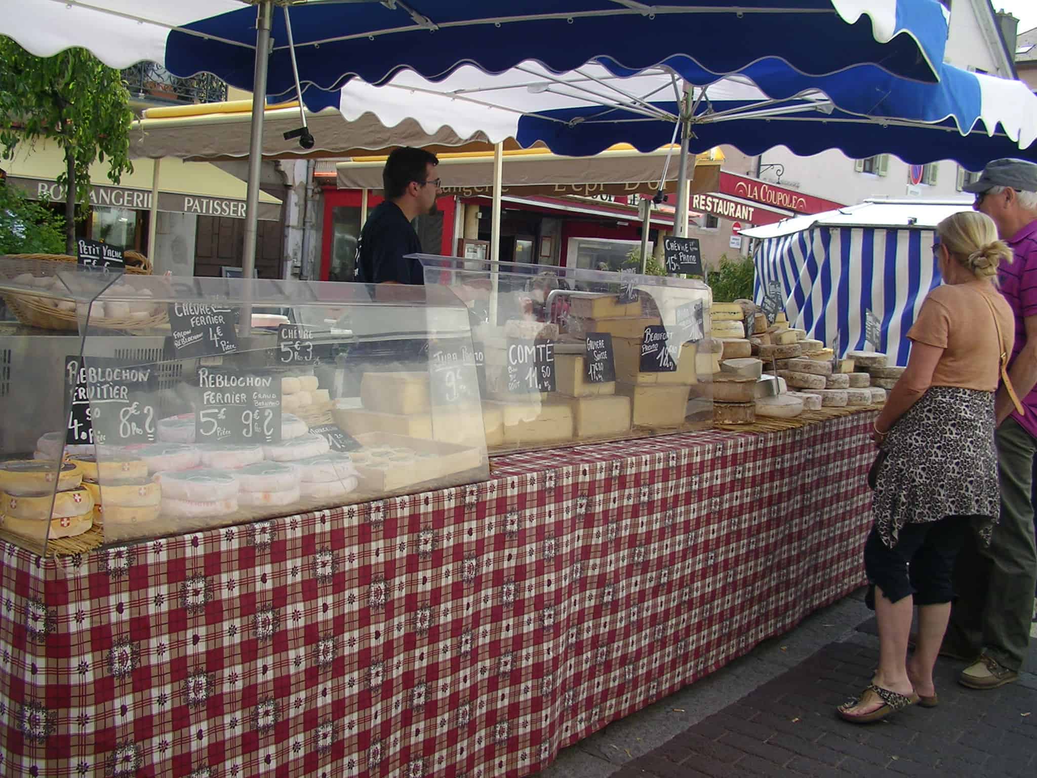 Moving street market at Annecy. Look at the number of cheeses! Annecy, market, France