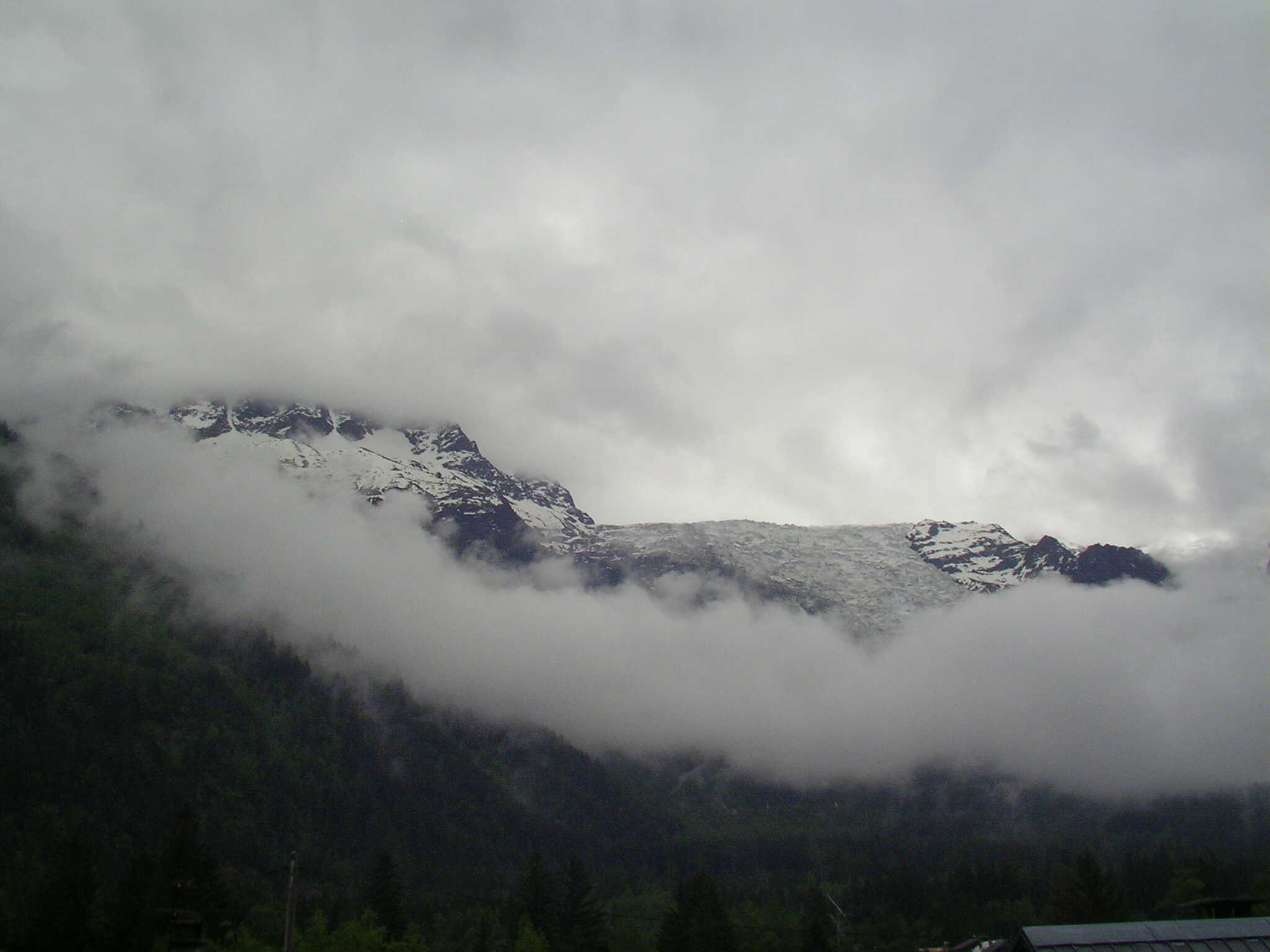 Clouds kiss the Alps. Chamonix, french alps, france, snow, clouds